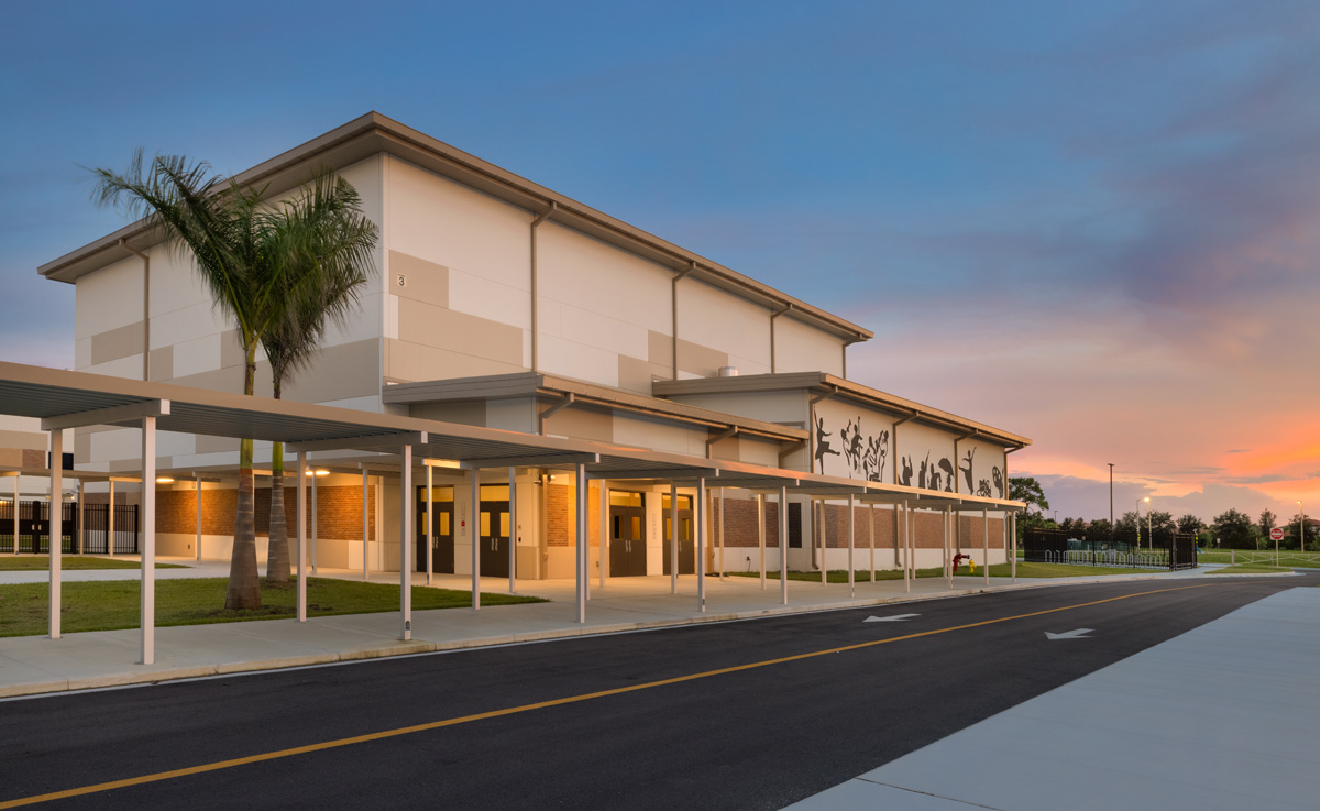 Architectural dusk view of the Gateway High School arts building in Fort Myers, FL.